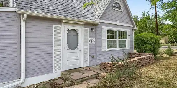 Image 3: Inviting entry welcomes you into a bright home filled with character and natural light.