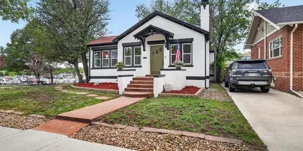 Image 3: Front of house and neighbor's driveway