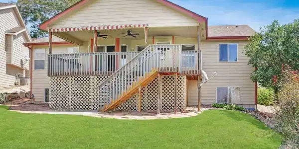 Image 2: Back view of home and yard Image 2: Back view of home and yard