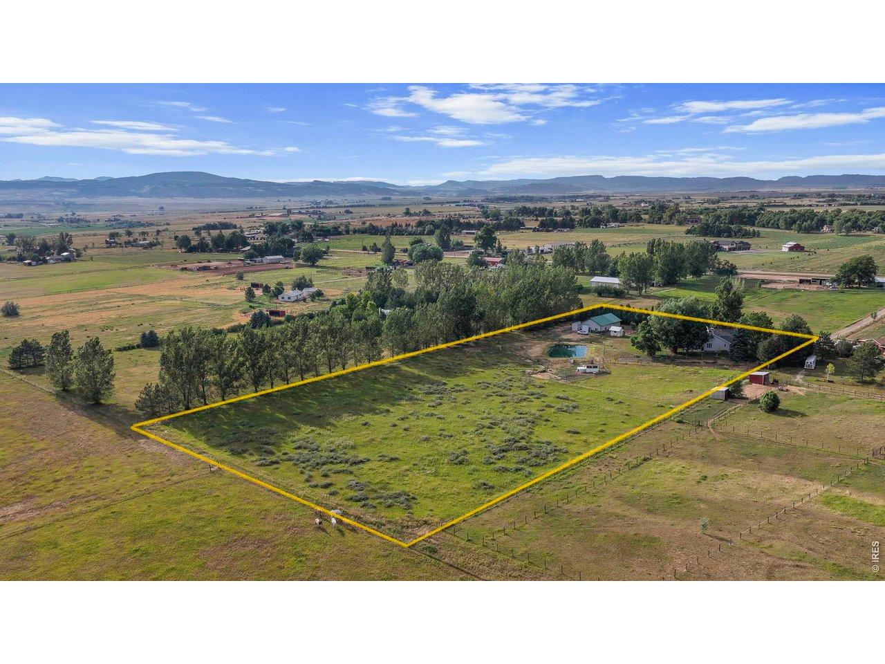 Image 3: Your new Oasis! This view is looking to the NW, emphasizing the 5 acres of pasture. House is surrounded by shade trees in upper right corner Image 3: Your new Oasis! This view is looking to the NW, emphasizing the 5 acres of pasture. House is surrounded by shade trees in upper right corner
