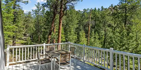Image 3: Back deck overlooks the forest, totally private Image 3: Back deck overlooks the forest, totally private