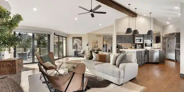 Image 2: The main level is anchored by expansive living and dining areas that flow seamlessly into the open-concept kitchen and great room. The primary bedroom is also on the main level Image 2: The main level is anchored by expansive living and dining areas that flow seamlessly into the open-concept kitchen and great room. The primary bedroom is also on the main level