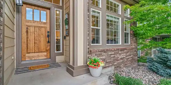Image 2: Newly updated front door, and garage doors add to the Colorado feel of this home. Image 2: Newly updated front door, and garage doors add to the Colorado feel of this home.