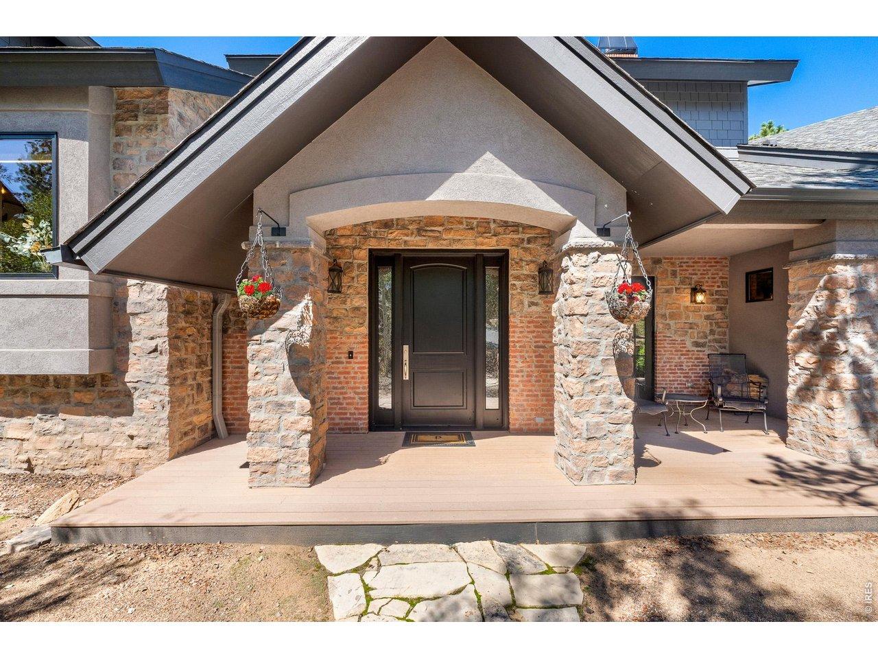 Image 4: The front entrance has a large covered porch and attached 996 SF Garage. Image 4: The front entrance has a large covered porch and attached 996 SF Garage.