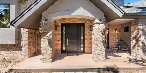 Image 4: The front entrance has a large covered porch and attached 996 SF Garage. Image 4: The front entrance has a large covered porch and attached 996 SF Garage.