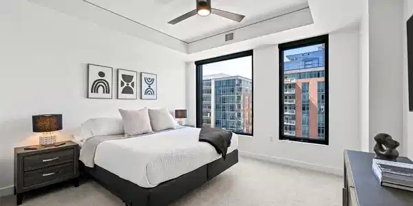 Image 3: Primary bedroom with ceiling fan and wall mounted TV Image 3: Primary bedroom with ceiling fan and wall mounted TV