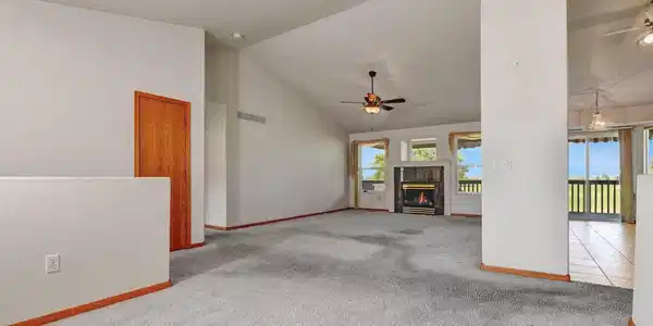 Image 4: Living room - Kitchen dining area to the right Hall to bedrooms to the left Image 4: Living room - Kitchen dining area to the right Hall to bedrooms to the left