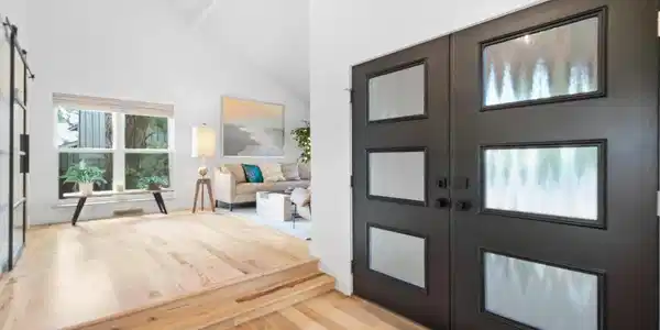 Image 3: Natural light double-door entryway leads to the open-floor concept w/rich hickory hardwood floors spanning both levels of this beautifully updated home.
