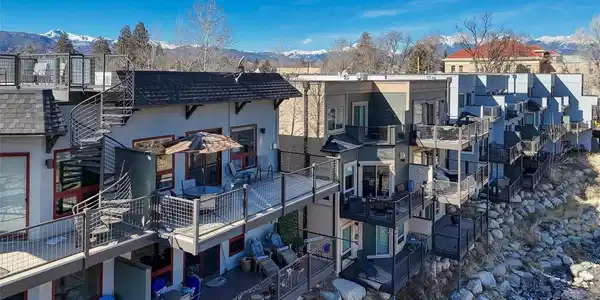 Image 3: Unit J's Riverfront Deck with the umbrella up