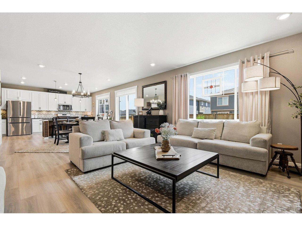 Image 3: Open Floor plan from living room to eat-in area flowing to luxurious kitchen Image 3: Open Floor plan from living room to eat-in area flowing to luxurious kitchen