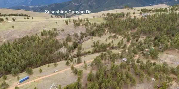 Image 2: Arial view of the building envelope. Please be aware that any land and/or structures shown in the listing photos outside of the approximate lot lines are not  for sale.