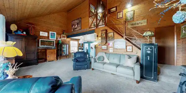 Image 3: All wood interior walls, living room