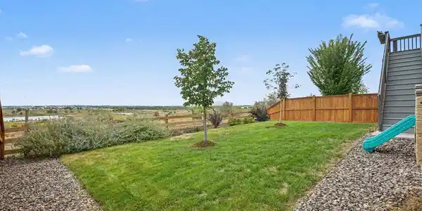 Image 4: Fully landscaped backyard with fencing installed