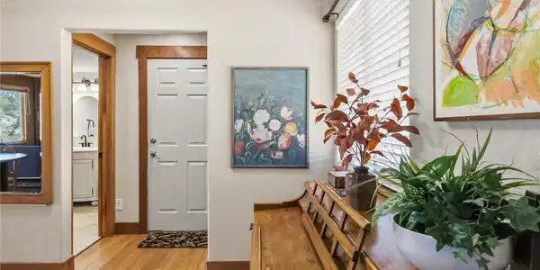 Image 4: The entryway leads to the garage and a powder room on the main level. Image 4: The entryway leads to the garage and a powder room on the main level.