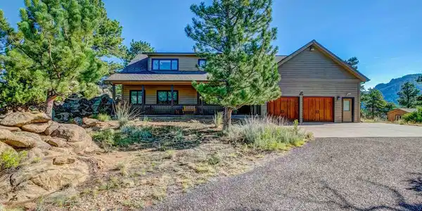 Image 3: This 3-bedroom, 3-bath home is surrounded by mature pine trees. Image 3: This 3-bedroom, 3-bath home is surrounded by mature pine trees.