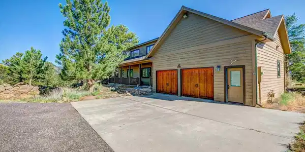 Image 4: Plenty of parking and an oversized garage with more space for storage. Image 4: Plenty of parking and an oversized garage with more space for storage.