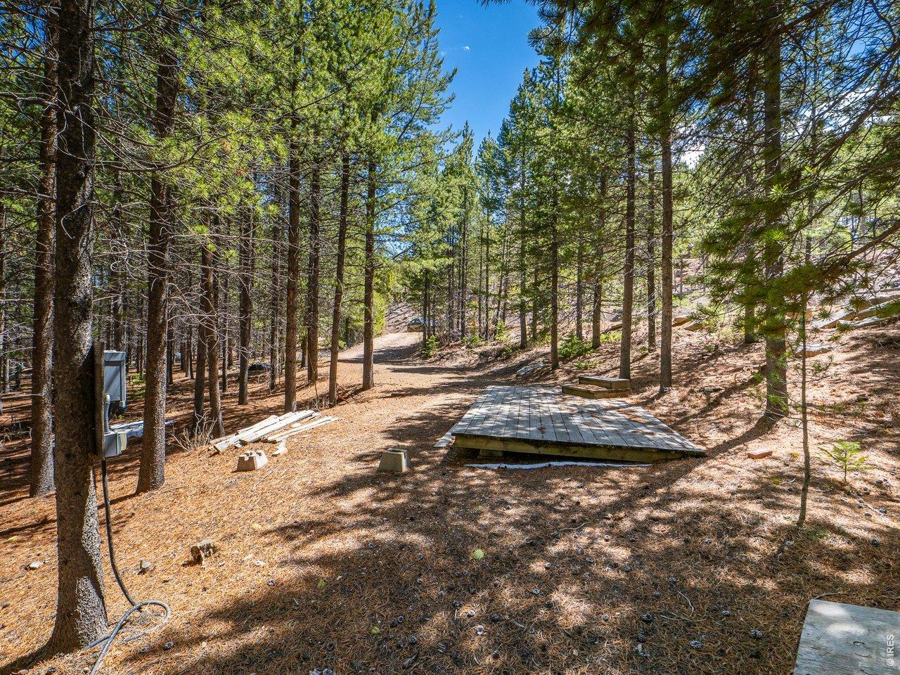 Image 2: Well treed property with power and decking. Image 2: Well treed property with power and decking.
