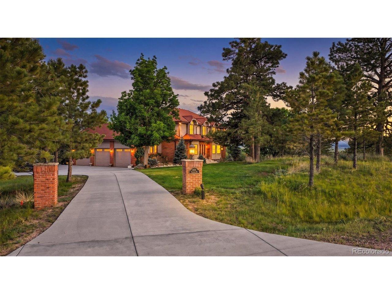 Image 3: A long concrete driveway with brick entry columns leads to the home, framed by ponderosa pines, native grasses, and a beautifully maintained front lawn. Image 3: A long concrete driveway with brick entry columns leads to the home, framed by ponderosa pines, native grasses, and a beautifully maintained front lawn.