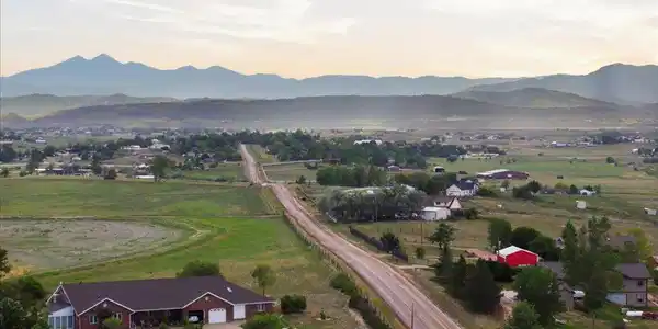 Image 2: Home on the right with red barn Image 2: Home on the right with red barn
