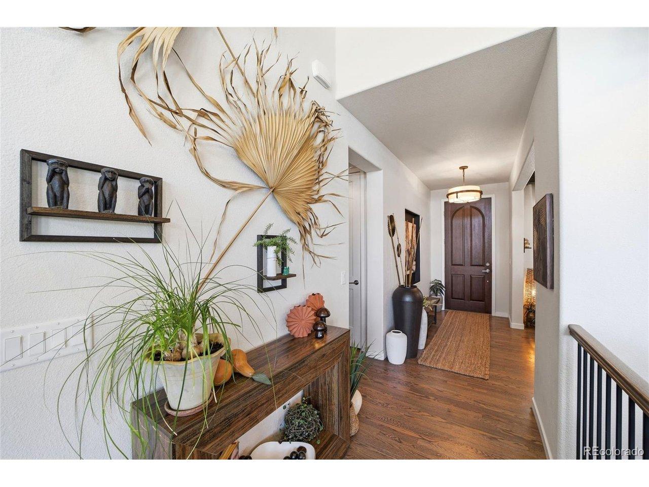 Image 3: Entryway with 8' doors throughout main level and solid red oak flooring