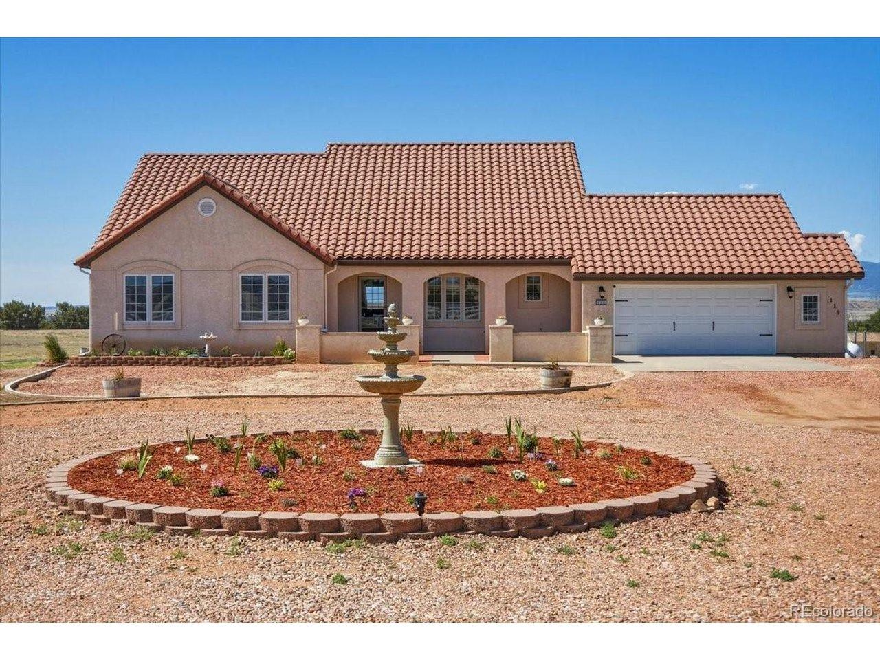 Image 1: Attractive ranch-style home featuring a tile roof, front court yard, and circular driveway, all set against a backdrop of mountain views and open skies. Image 1: Attractive ranch-style home featuring a tile roof, front court yard, and circular driveway, all set against a backdrop of mountain views and open skies.