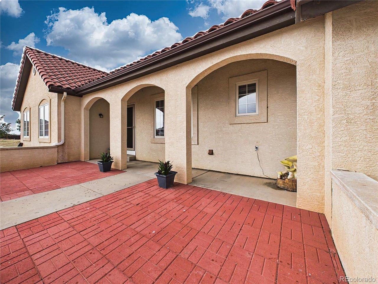 Image 2: Inviting front porch features arched architectural details and ample space to enjoy peaceful outdoor relaxation. Image 2: Inviting front porch features arched architectural details and ample space to enjoy peaceful outdoor relaxation.