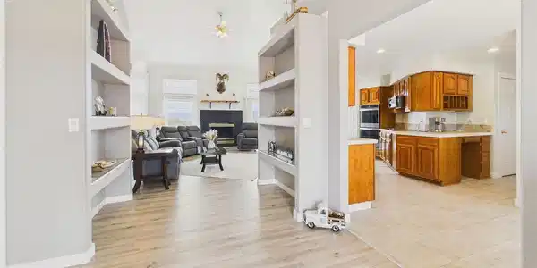 Image 4: Thoughtfully designed layout flows seamlessly from the living room into the kitchen, ideal for everyday living and entertaining. Image 4: Thoughtfully designed layout flows seamlessly from the living room into the kitchen, ideal for everyday living and entertaining.