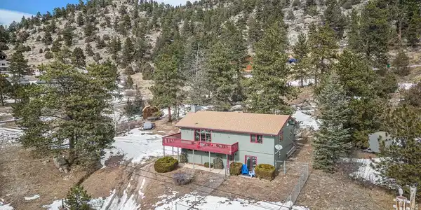 Image 2: Lovely house sits on 1.4 acres of trees, rocky outcroppings and meadow, partially fenced for play and pets. Image 2: Lovely house sits on 1.4 acres of trees, rocky outcroppings and meadow, partially fenced for play and pets.