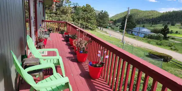 Image 4: Relax and enjoy the many views from the wrap-around deck. Image 4: Relax and enjoy the many views from the wrap-around deck.