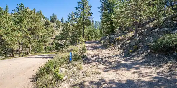 Image 4: Driveway entrance off of Iron Mountain Drive. Image 4: Driveway entrance off of Iron Mountain Drive.