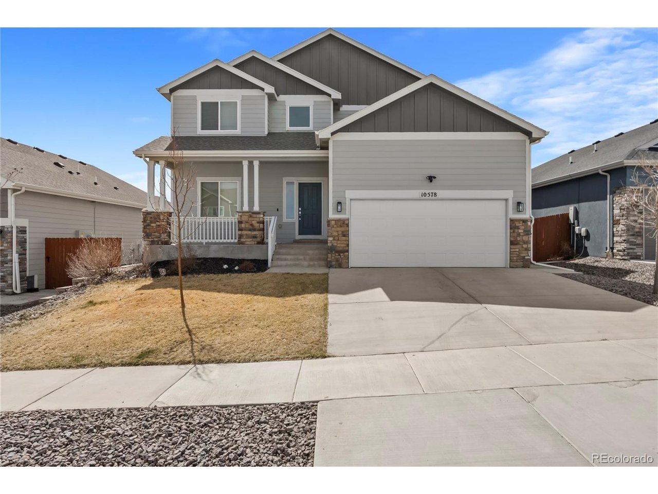 Image 2: Stunning 2-Story home featuring a 2 car garage, covered porch, stone siding, and concrete driveway Image 2: Stunning 2-Story home featuring a 2 car garage, covered porch, stone siding, and concrete driveway