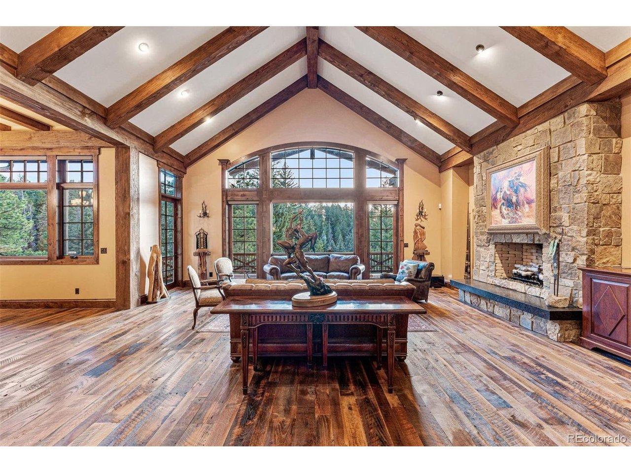 Image 4: Vaulted great room featuring exposed timber beams and open living design Image 4: Vaulted great room featuring exposed timber beams and open living design