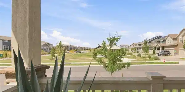Image 3: front porch over-looking park + playground