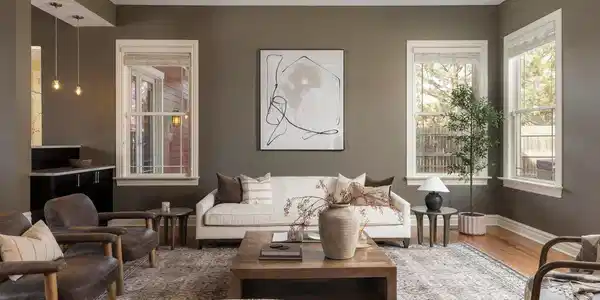 Image 3: Continue through the main level and the home opens into a beautifully connected living space where the family room, dining area, and kitchen flow together while still feeling distinct, creating an ideal layout for both entertaining and daily life.