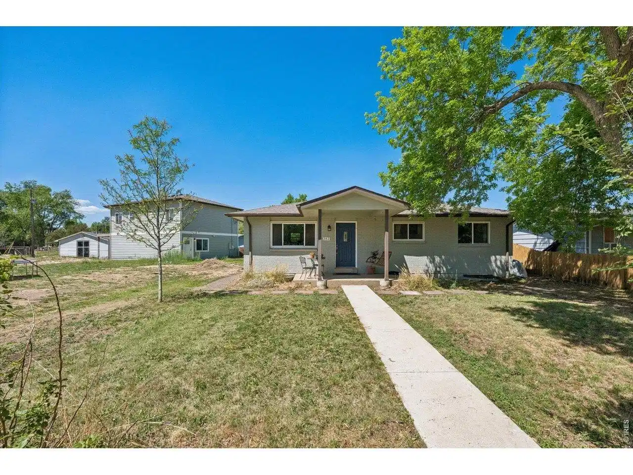 Image 1: SE facing Main House with field to the SE and 2-story ADU to the left Image 1: SE facing Main House with field to the SE and 2-story ADU to the left