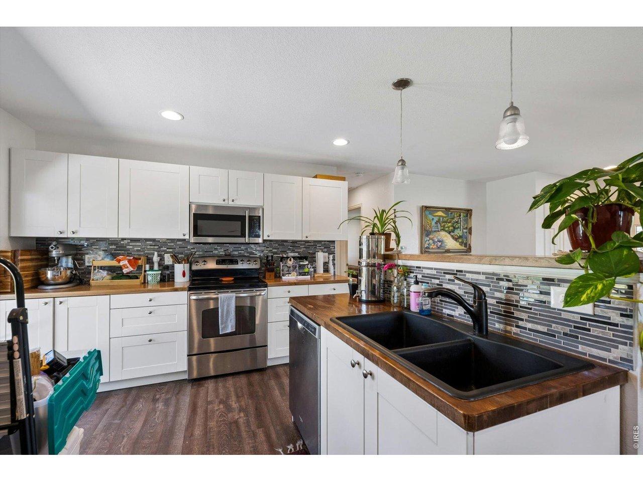 Image 4: Main house Butcher Block Kitchen countertops, LVP flooring, SS appliances