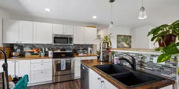 Image 4: Main house Butcher Block Kitchen countertops, LVP flooring, SS appliances Image 4: Main house Butcher Block Kitchen countertops, LVP flooring, SS appliances