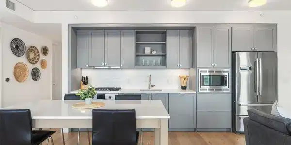 Image 4: Designed for both everyday living and entertaining, the kitchen pairs Bosch appliances, a gas cooktop, quartz surfaces, and sleek contemporary cabinetry.