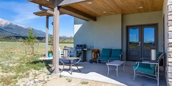 Image 4: Side patio that is on a full foundation that can be completed into an additional room