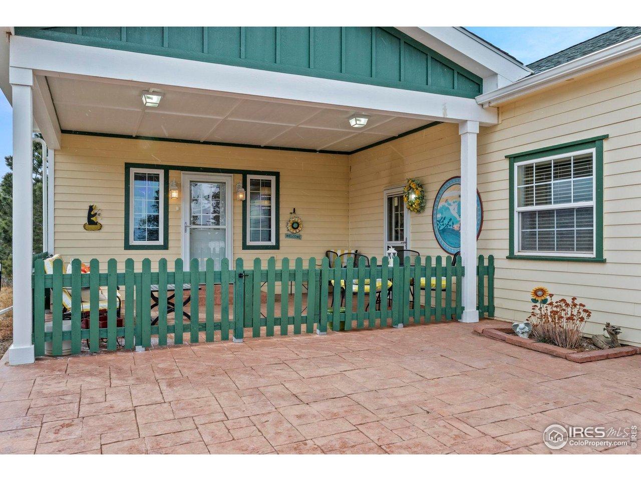 Image 3: The pinnacle of indoor/outdoor living, the 266 square foot covered porch with views over Nederland, to Barker reservoir and towards Eldora Ski Resort is sure to be a favorite spot