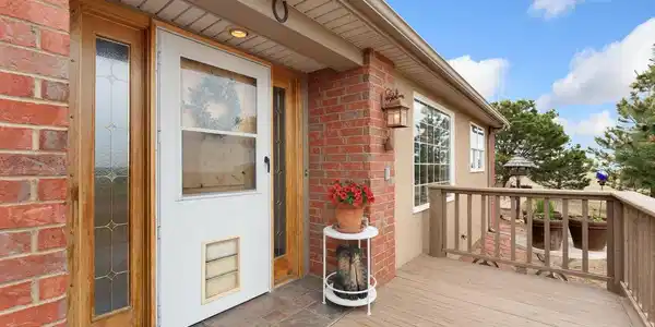 Image 4: Welcoming front porch with beautiful views