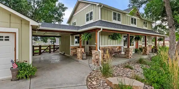 Image 3: Covered entry to the mud room and front door Image 3: Covered entry to the mud room and front door