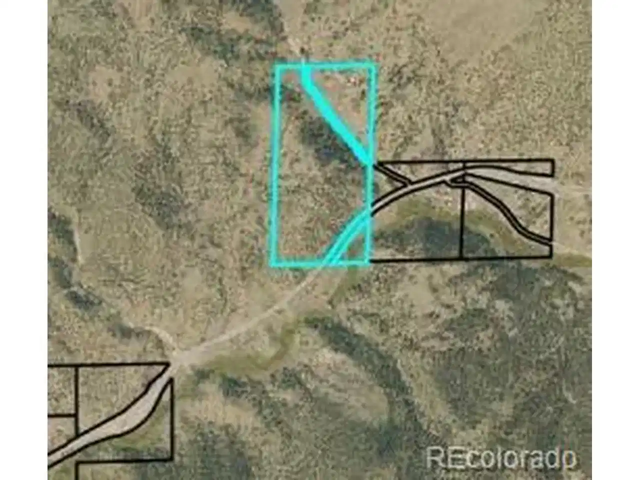 Image 1: Aerial view of the 67 acre parcel and surrounding forest, showing regional context near Hwy 285.