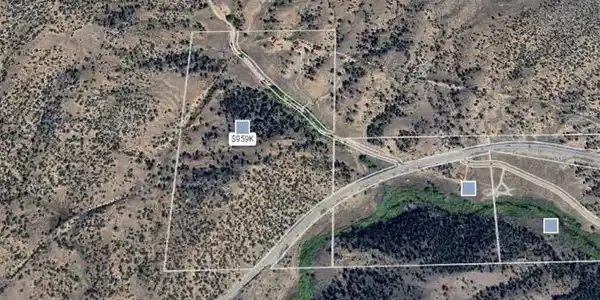 Image 2: Aerial with parcel boundary outlined, showing the compound's position within the acreage.
