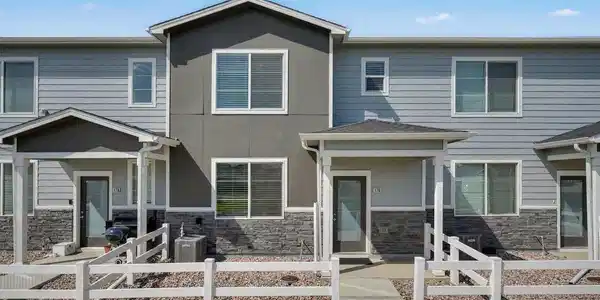 Image 3: Front of the home with a fenced yard and covered patio. Image 3: Front of the home with a fenced yard and covered patio.