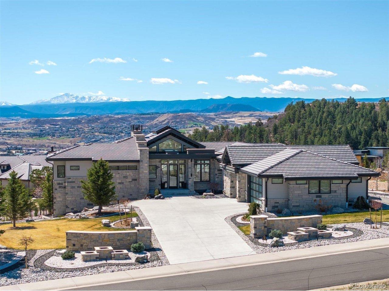 Image 1: Custom modern ranch, positioned on an elevated corner lot with sweeping Pikes Peak views, saltwater pool and spa, and phenomenal outdoor living.