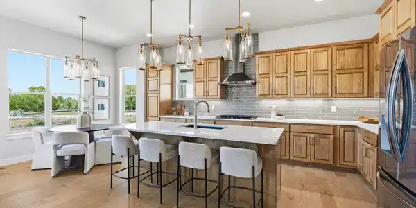 Image 3: Gourmet kitchen featuring quartz countertops, stainless steel appliances, and abundant cabinetry. Image 3: Gourmet kitchen featuring quartz countertops, stainless steel appliances, and abundant cabinetry.