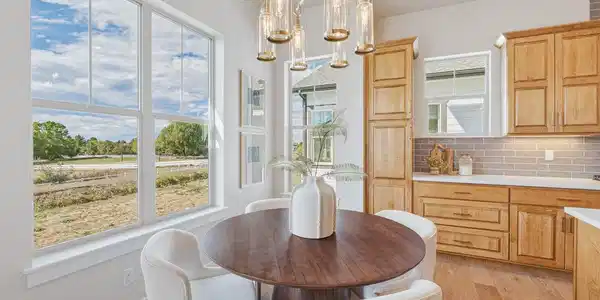 Image 4: Dedicated dining space with natural light and elevated finishes. Image 4: Dedicated dining space with natural light and elevated finishes.