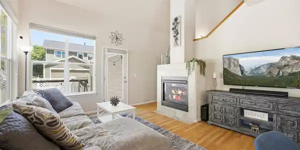 Image 4: Open living room with fireplace