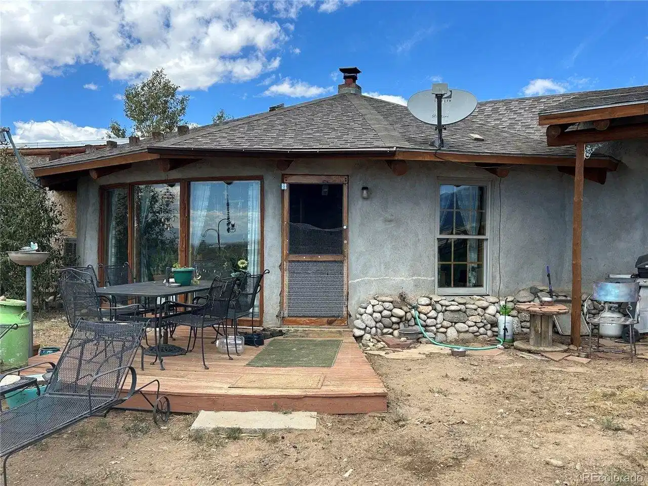 Image 1: Front of House with porch on southside
